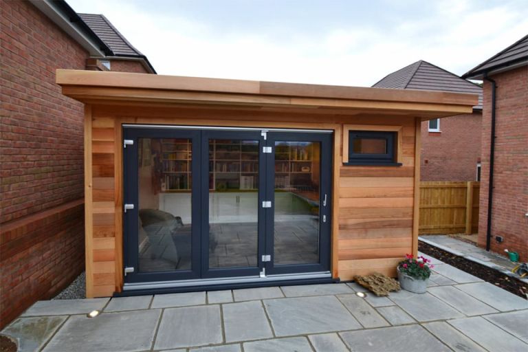 Garden office exterior. Western red cedar TGV cladding boards with matching soffits, fascia, and corner trims