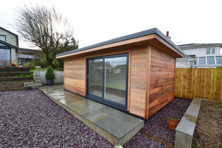 The front of the garden room showing the UPVC in-line sliding doors