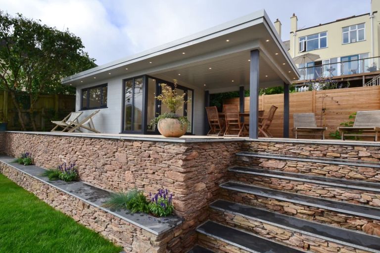 External view of a bespoke garden room with undercover outdoor area