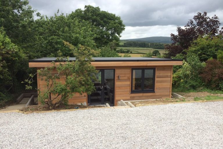 Office with side store. The exterior is clad with Western Red Cedar