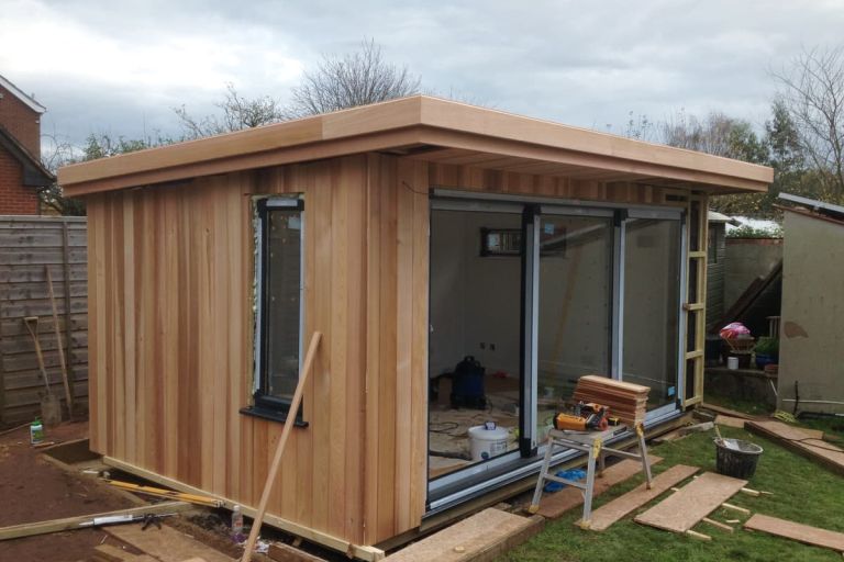 Side view showing the powder coated aluminium casement windows and sliding doors